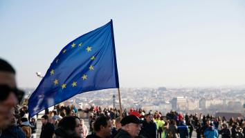 People on street with EU flag