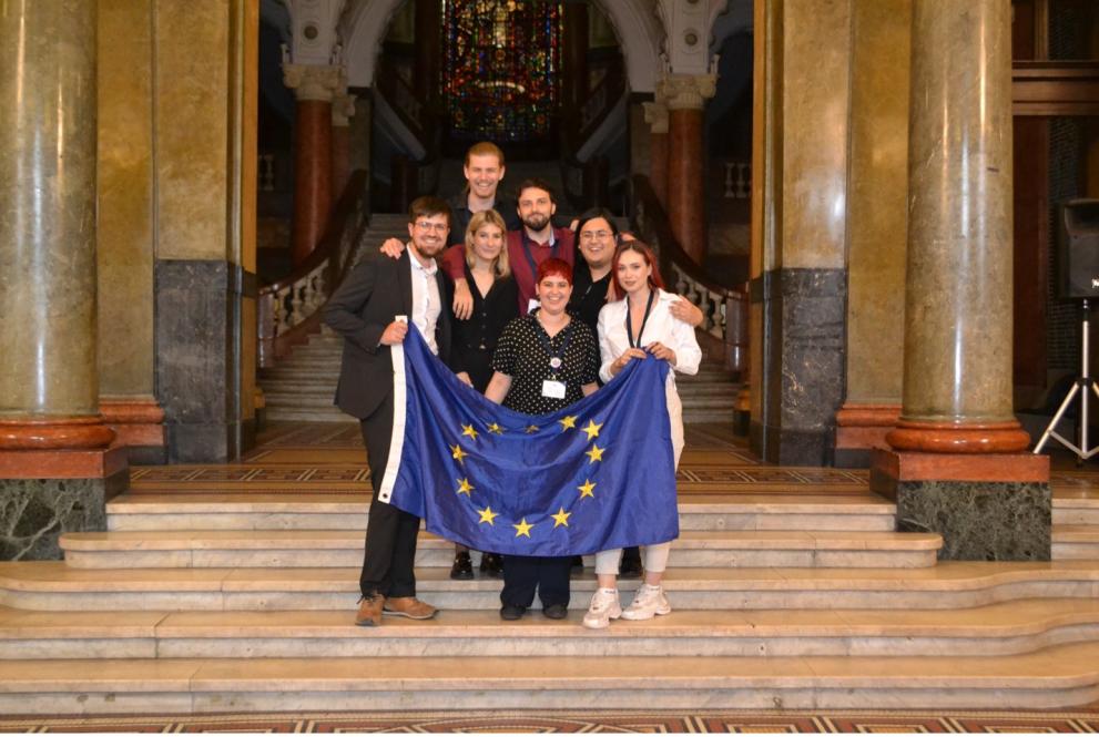 Participants holding EU Flag at ECI Simulation MEU Sofia