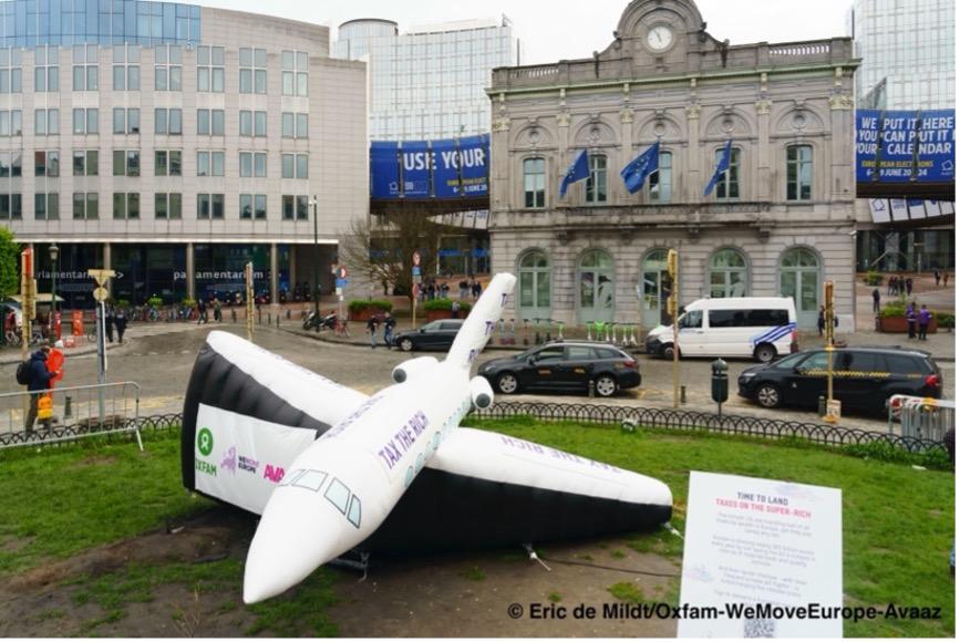Avaaz, WeMove Europe and Oxfam, alongside a group of climate activists, land a private jet outside the European Parliament during a plenary session on April 11, 2024.